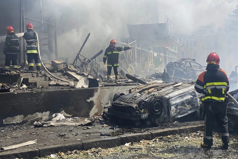 Firefighters work to extinguish a blaze after missiles hit an office building and damaged nearby residential buildings in Vinnytsia. AP